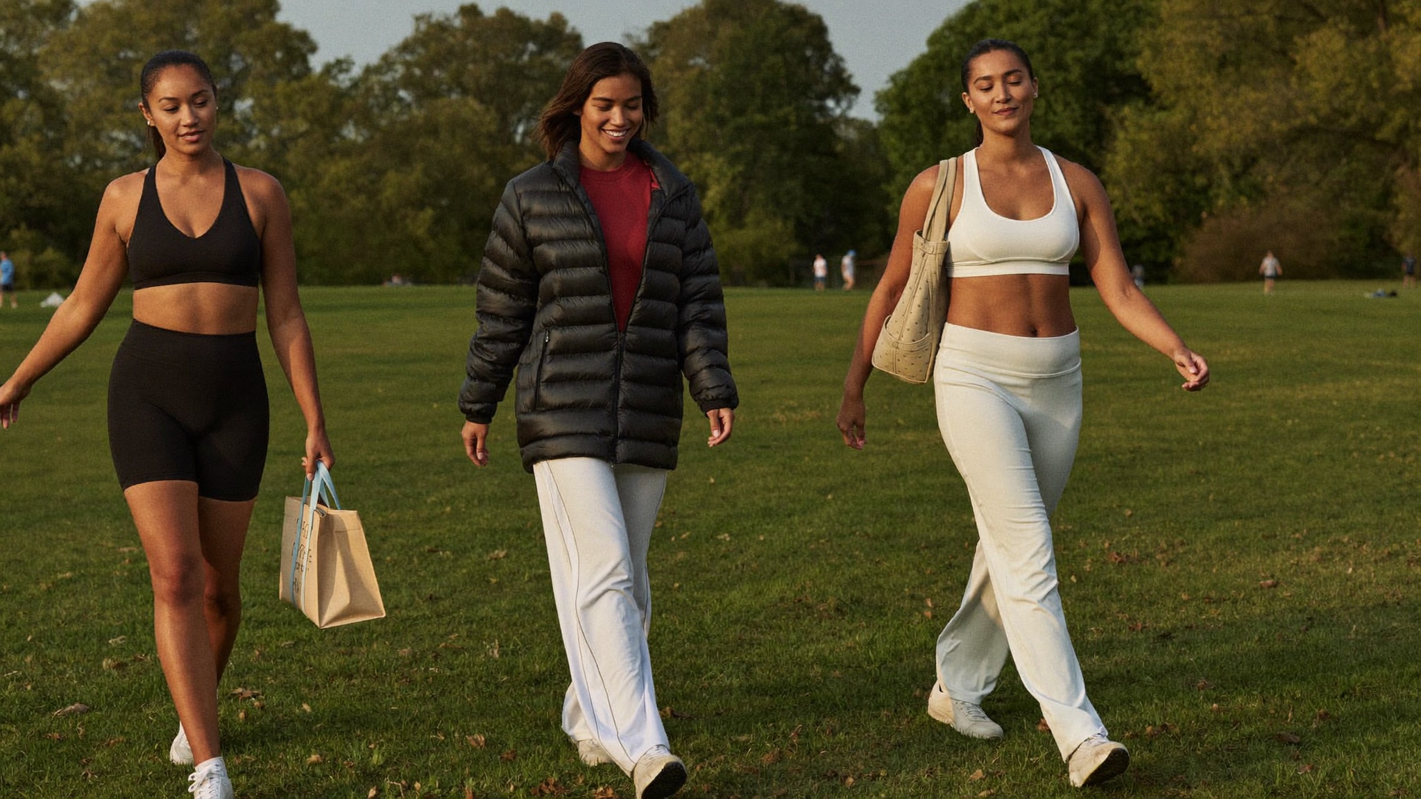 Active mothers walking together outdoors, relaxed and at ease